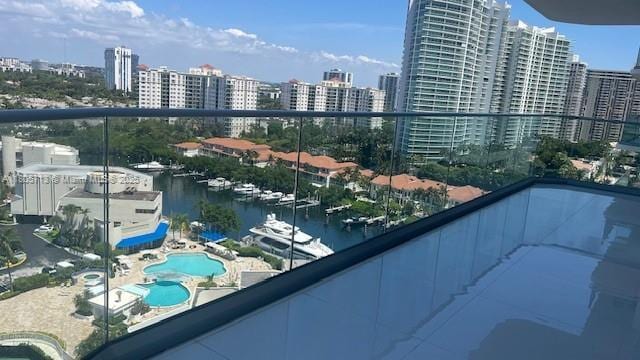 19707 Turnberry Way Unit 18D, Aventura, FL 33180 - balcony featuring a view of city, view of pool, and a water view