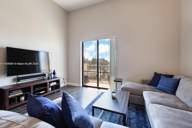 8395 SW 73rd Ave Unit 312, Miami, FL 33143 - living area featuring baseboards and wood finished floors