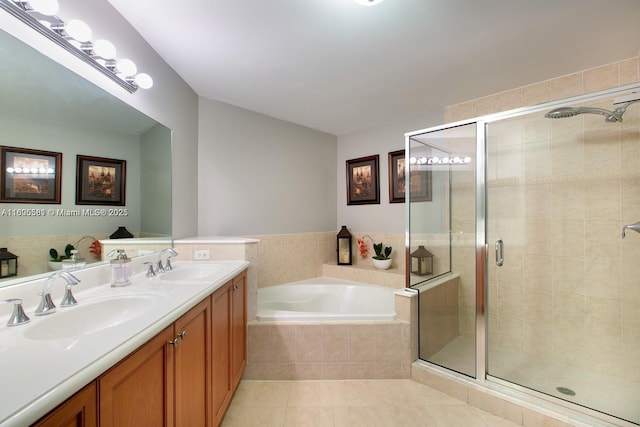 8395 SW 73rd Ave Unit 312, Miami, FL 33143 - full bath featuring a shower stall, a garden tub, tile patterned flooring, and double vanity