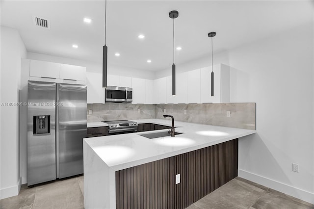 3431-3433 SW 16th Ter, Miami, FL 33145 - kitchen featuring stainless steel appliances, a sink, a peninsula, backsplash, and recessed lighting