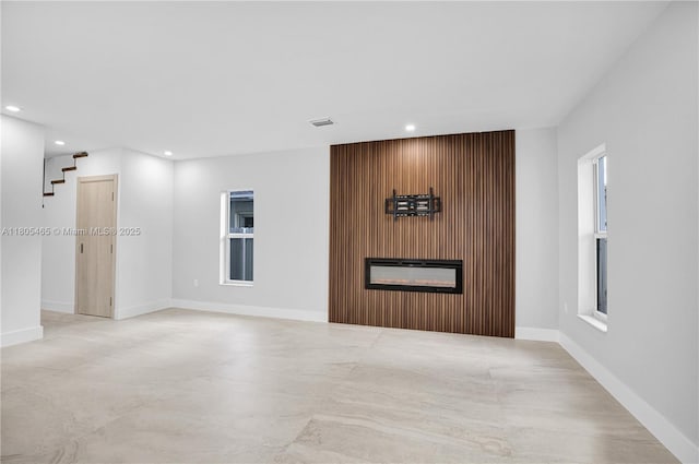 3431-3433 SW 16th Ter, Miami, FL 33145 - unfurnished living room featuring a glass covered fireplace, recessed lighting, and baseboards