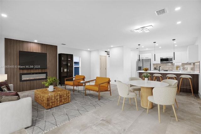 3431-3433 SW 16th Ter, Miami, FL 33145 - dining area featuring recessed lighting and a glass covered fireplace