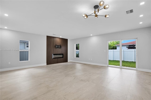 3431-3433 SW 16th Ter, Miami, FL 33145 - unfurnished living room with a chandelier, a fireplace, baseboards, and recessed lighting