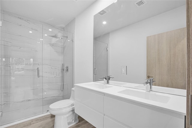 3431-3433 SW 16th Ter, Miami, FL 33145 - full bathroom with toilet, a marble finish shower, wood finished floors, double vanity, and recessed lighting