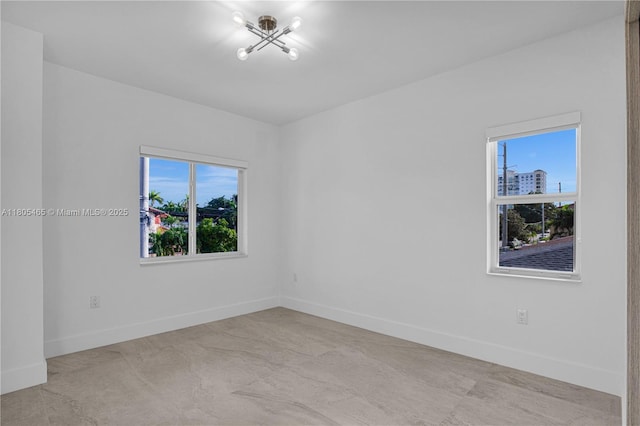 3431-3433 SW 16th Ter, Miami, FL 33145 - unfurnished room with baseboards and a chandelier