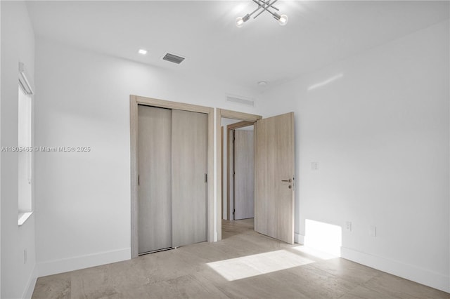 3431-3433 SW 16th Ter, Miami, FL 33145 - unfurnished bedroom featuring a closet, a chandelier, and baseboards