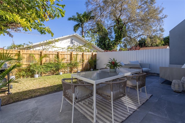 2345 SW 16th St, Miami, FL 33145 - view of patio featuring a fenced backyard and outdoor dining space