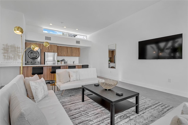 2345 SW 16th St, Miami, FL 33145 - living area featuring washer / dryer and baseboards