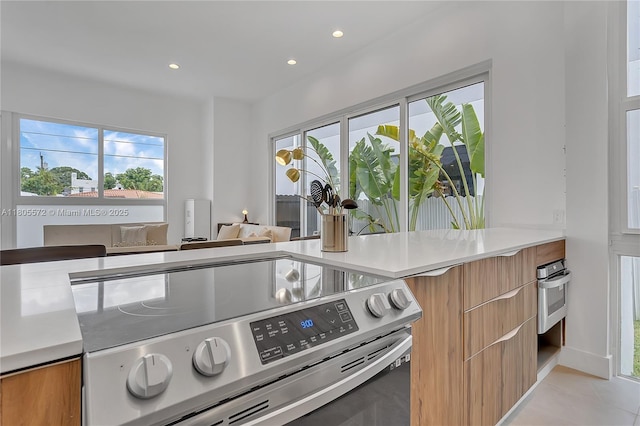 2345 SW 16th St, Miami, FL 33145 - kitchen featuring appliances with stainless steel finishes, modern cabinets, light countertops, recessed lighting, and light tile patterned floors