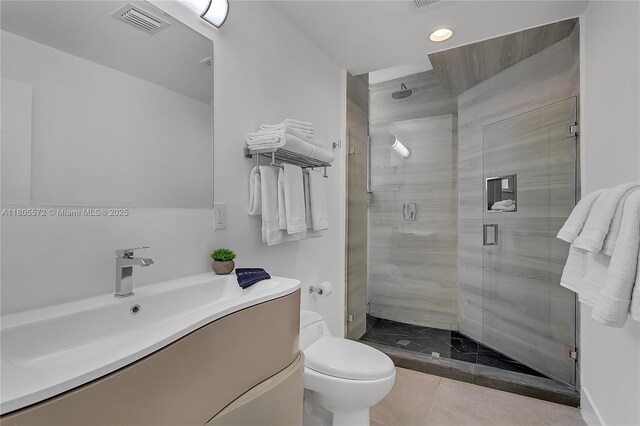 2345 SW 16th St, Miami, FL 33145 - full bath with a stall shower, toilet, recessed lighting, tile patterned floors, and vanity