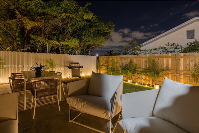 2345 SW 16th St, Miami, FL 33145 - patio at night featuring fence and outdoor dining space