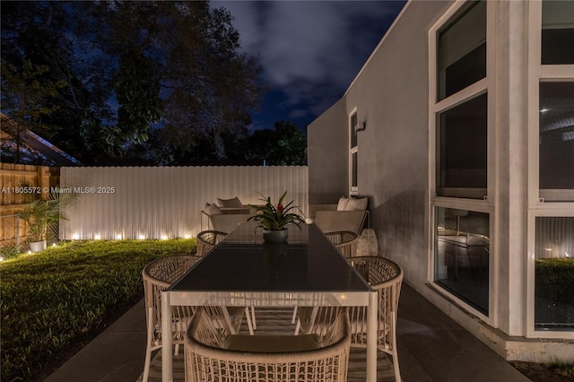 2345 SW 16th St, Miami, FL 33145 - patio at night featuring fence and outdoor dining area