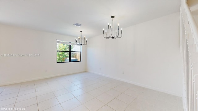 10004 SW 231st Ln, Miami, FL 33190 - spare room featuring a chandelier, baseboards, and light tile patterned floors