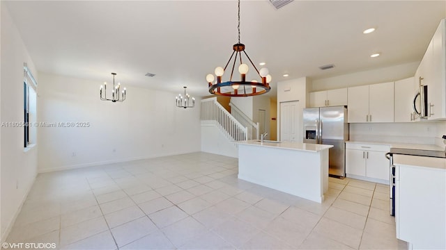 10004 SW 231st Ln, Miami, FL 33190 - kitchen with stainless steel appliances, a chandelier, light countertops, recessed lighting, and white cabinets