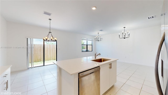 10004 SW 231st Ln, Miami, FL 33190 - kitchen with a sink, stainless steel dishwasher, a chandelier, light tile patterned flooring, and decorative light fixtures