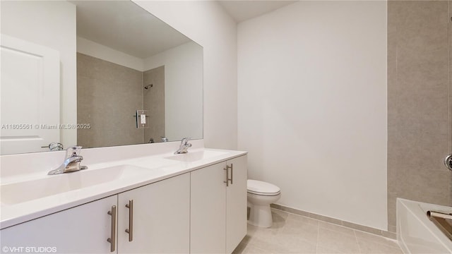 10004 SW 231st Ln, Miami, FL 33190 - full bathroom with toilet, tile patterned flooring, baseboards, double vanity, and washtub / shower combination