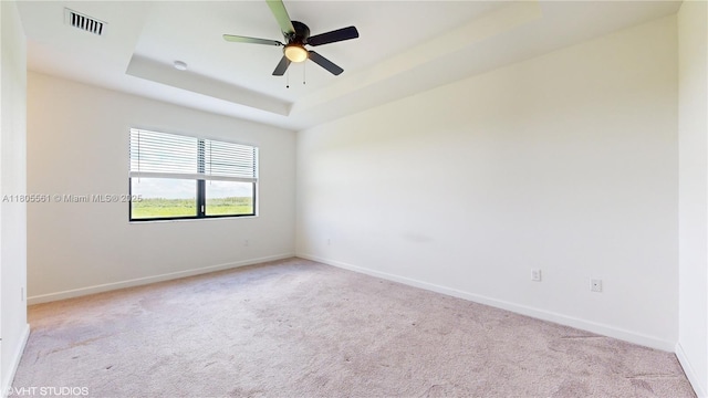 10004 SW 231st Ln, Miami, FL 33190 - spare room with carpet flooring, a tray ceiling, baseboards, and ceiling fan