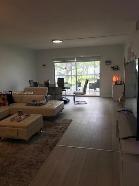 12500 SW 5th Ct Unit 210M, Pembroke Pines, FL 33027 - living room featuring wood finished floors