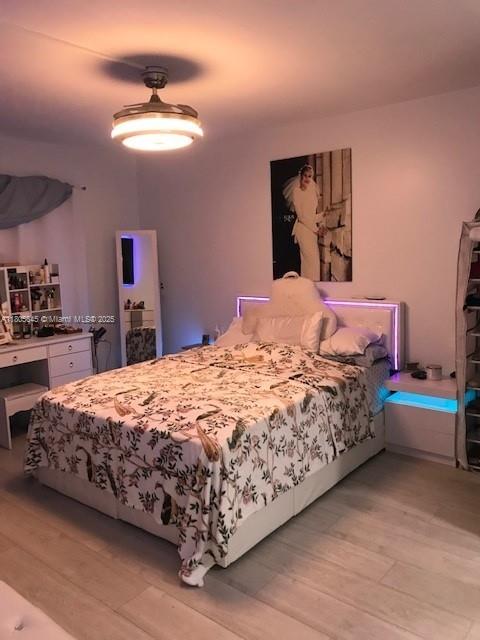 12500 SW 5th Ct Unit 210M, Pembroke Pines, FL 33027 - bedroom featuring light wood-style flooring