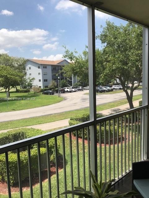 12500 SW 5th Ct Unit 210M, Pembroke Pines, FL 33027 - balcony with a porch