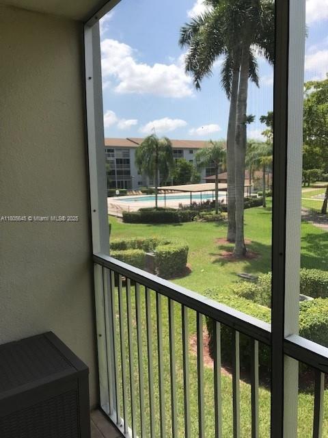 12500 SW 5th Ct Unit 210M, Pembroke Pines, FL 33027 - balcony with view of pool