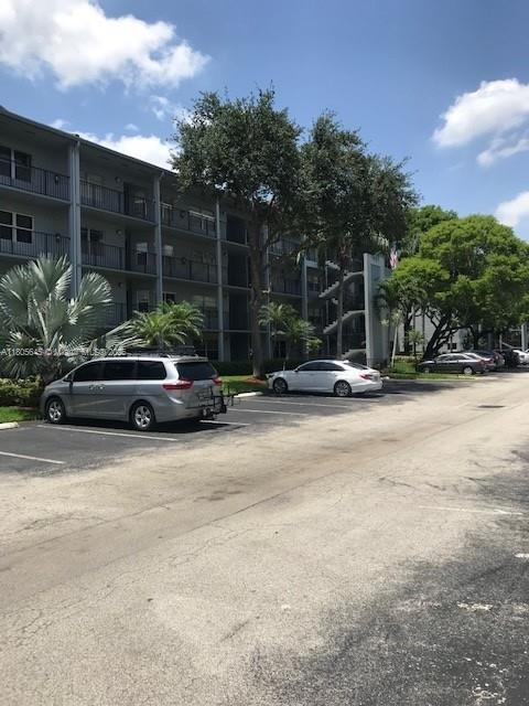 12500 SW 5th Ct Unit 210M, Pembroke Pines, FL 33027 - view of uncovered parking lot
