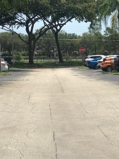 12500 SW 5th Ct Unit 210M, Pembroke Pines, FL 33027 - view of concrete road with traffic signs