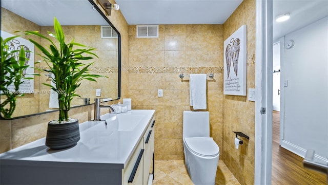 2750 NE 183rd St Unit 1610, Aventura, FL 33160 - bathroom featuring tile walls, vanity, and toilet