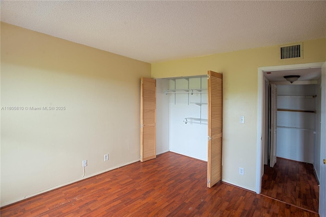 405 S Pine Island Rd Unit 405D, Plantation, FL 33324 - unfurnished bedroom with wood finished floors, a closet, a textured ceiling, and baseboards
