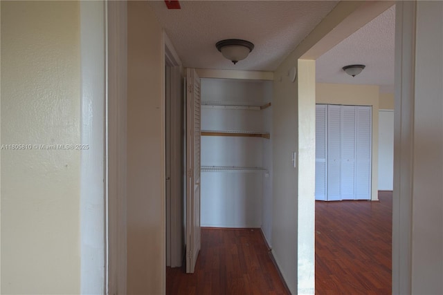 405 S Pine Island Rd Unit 405D, Plantation, FL 33324 - corridor with dark wood-type flooring and a textured ceiling