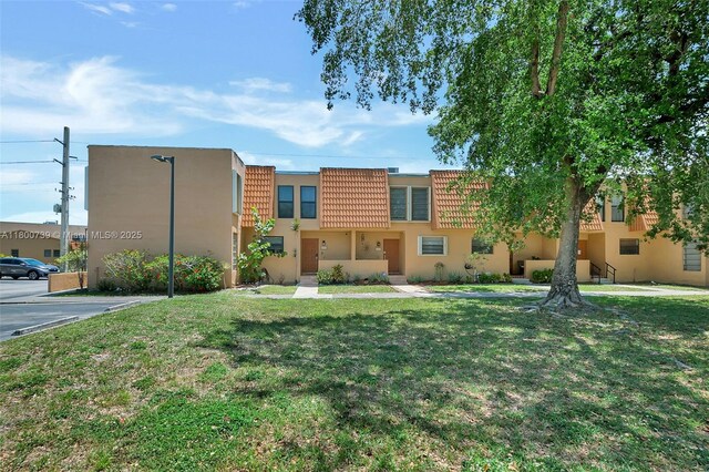 1541 NW 92nd Ave Unit 186, Pembroke Pines, FL 33024 - view of building exterior with uncovered parking