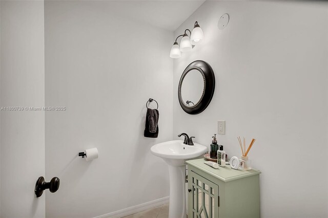 1541 NW 92nd Ave Unit 186, Pembroke Pines, FL 33024 - bathroom featuring a sink and baseboards
