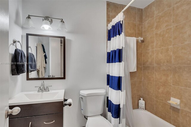 1541 NW 92nd Ave Unit 186, Pembroke Pines, FL 33024 - bathroom featuring toilet, vanity, and shower / bath combo with shower curtain