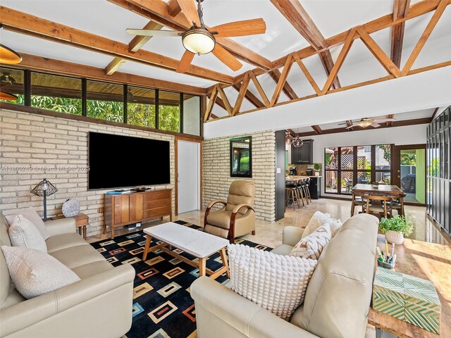 1519 Harrison St, Hollywood, FL 33020 - living room with a ceiling fan, brick wall, and beam ceiling