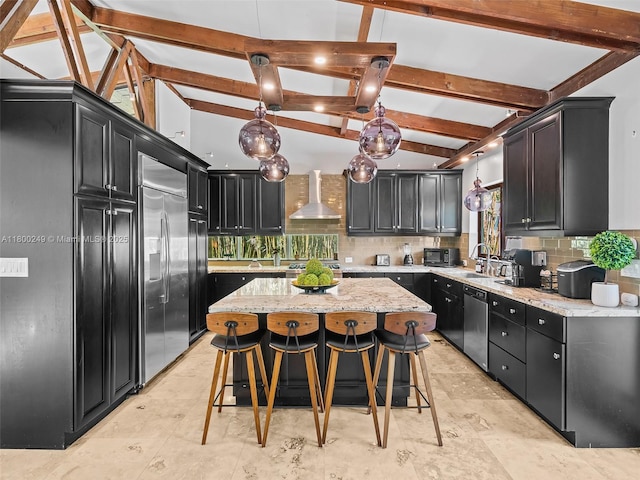 1519 Harrison St, Hollywood, FL 33020 - kitchen with wall chimney exhaust hood, appliances with stainless steel finishes, tasteful backsplash, and dark cabinetry