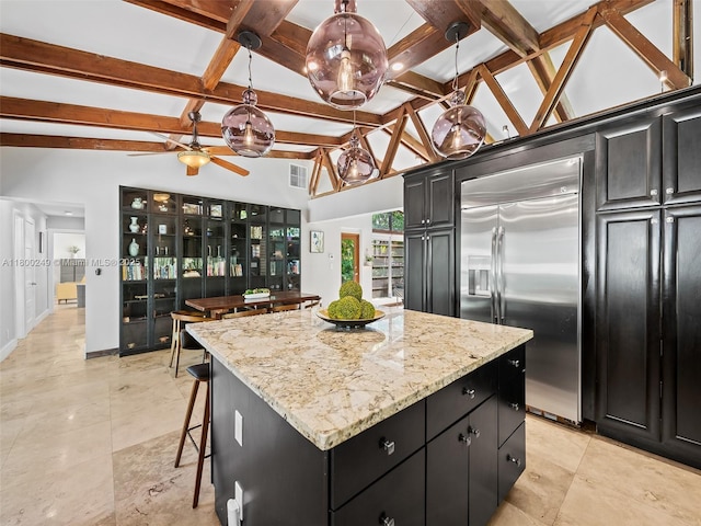 1519 Harrison St, Hollywood, FL 33020 - kitchen with built in refrigerator, dark cabinets, a center island, and baseboards