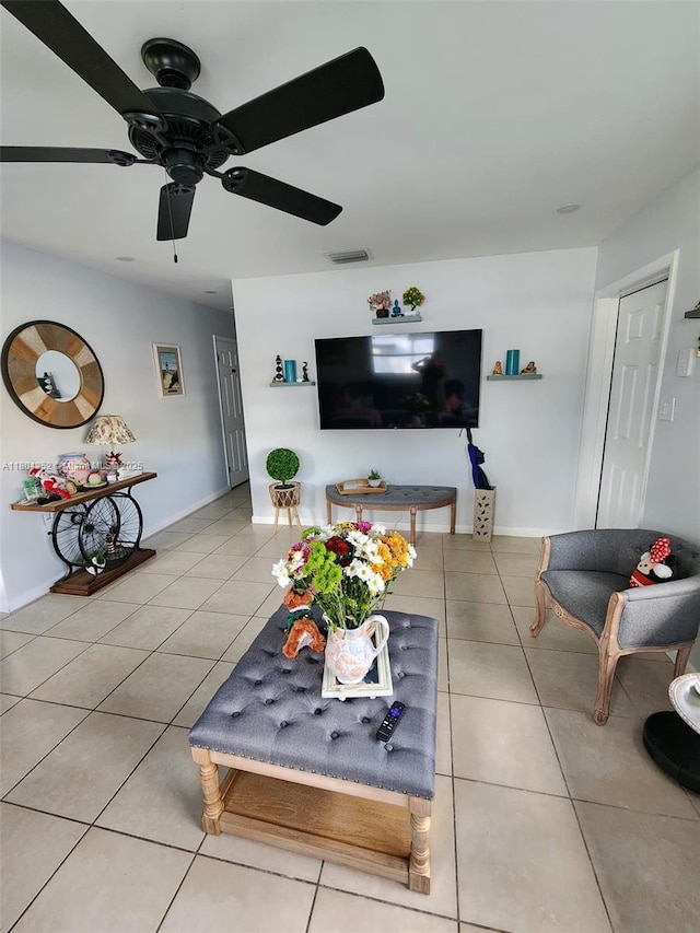 812 Lake Mcgregor Dr, Fort Myers, FL 33919 - living area with light tile patterned flooring, ceiling fan, and baseboards