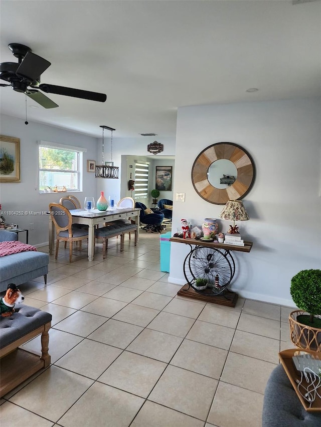 812 Lake Mcgregor Dr, Fort Myers, FL 33919 - living area featuring light tile patterned floors, baseboards, and a ceiling fan