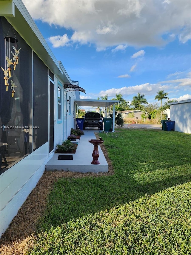 812 Lake Mcgregor Dr, Fort Myers, FL 33919 - view of green lawn with an attached carport