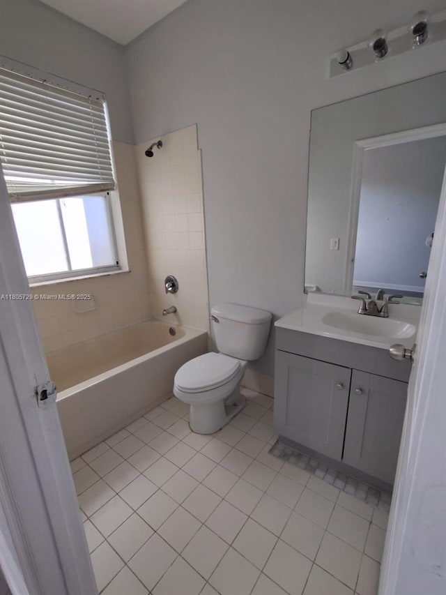 full bath featuring tile patterned floors, shower / bath combination, toilet, and vanity