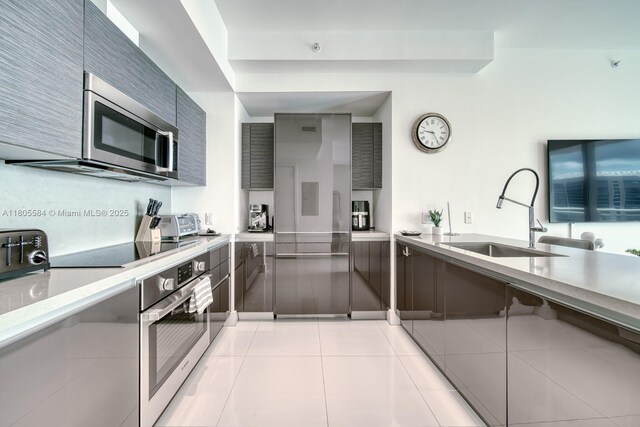 1080 Brickell Ave Unit 3802, Miami, FL 33131 - kitchen with appliances with stainless steel finishes, modern cabinets, and a sink