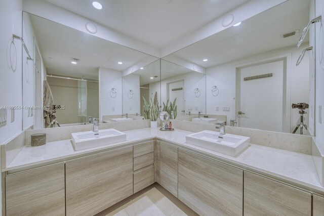 1080 Brickell Ave Unit 3802, Miami, FL 33131 - full bathroom featuring a shower with shower door, double vanity, recessed lighting, and tile patterned floors