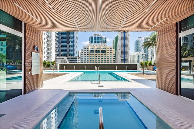1080 Brickell Ave Unit 3802, Miami, FL 33131 - community pool with a city view and a community hot tub