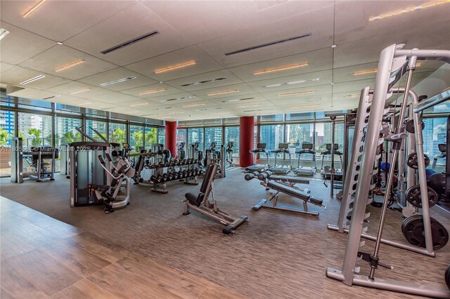 1080 Brickell Ave Unit 3802, Miami, FL 33131 - exercise room with floor to ceiling windows and a paneled ceiling