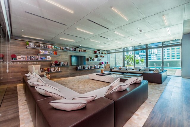 1080 Brickell Ave Unit 3802, Miami, FL 33131 - living area with wood finished floors, a wall of windows, and wooden walls