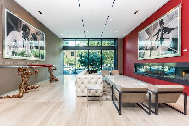1080 Brickell Ave Unit 3802, Miami, FL 33131 - game room featuring a wall of windows and wood finished floors