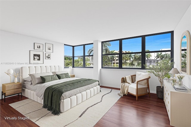 9180 W Bay Harbor Dr Unit 2C, Bay Harbor Islands, FL 33154 - bedroom with multiple windows, wood finished floors, and baseboards