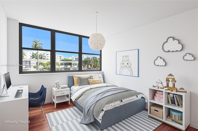 9180 W Bay Harbor Dr Unit 2C, Bay Harbor Islands, FL 33154 - bedroom featuring wood finished floors and baseboards