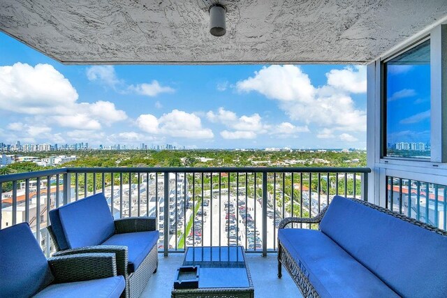 2655 Collins Ave Unit 1501, Miami Beach, FL 33140 - balcony with an outdoor living space and a view of skyline