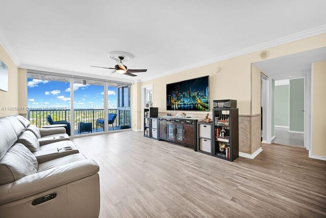 2655 Collins Ave Unit 1501, Miami Beach, FL 33140 - living room with wood finished floors, crown molding, a ceiling fan, floor to ceiling windows, and bar